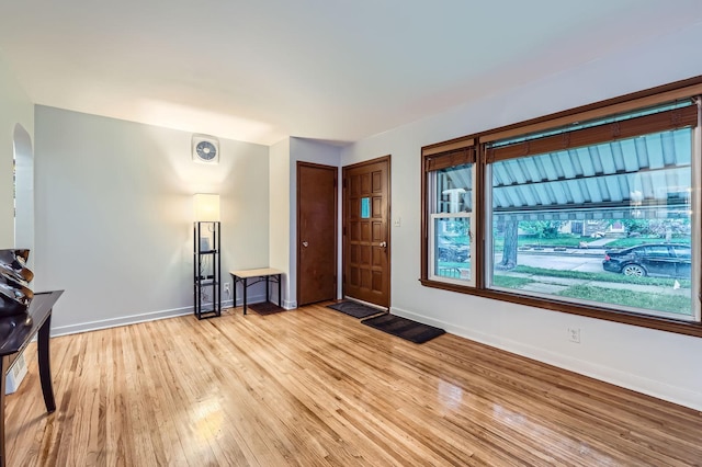 3427 Upton Ave N, Minneapolis, MN 55412 - entryway featuring light wood-type flooring, baseboards, and arched walkways