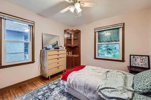 3427 Upton Ave N, Minneapolis, MN 55412 - bedroom featuring wood finished floors, baseboards, and a ceiling fan