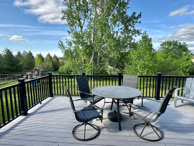 9808 Jenny Ln, Saint Wendel Twp, MN 56374 - deck featuring a yard and outdoor dining area