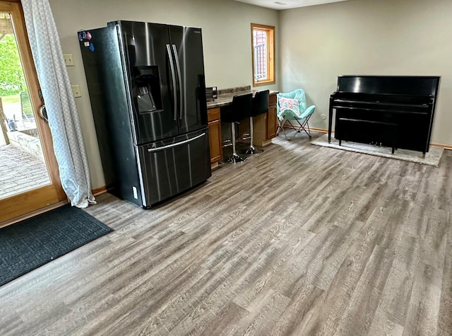 9808 Jenny Ln, Saint Wendel Twp, MN 56374 - kitchen featuring refrigerator with ice dispenser, light wood-style flooring, plenty of natural light, and baseboards