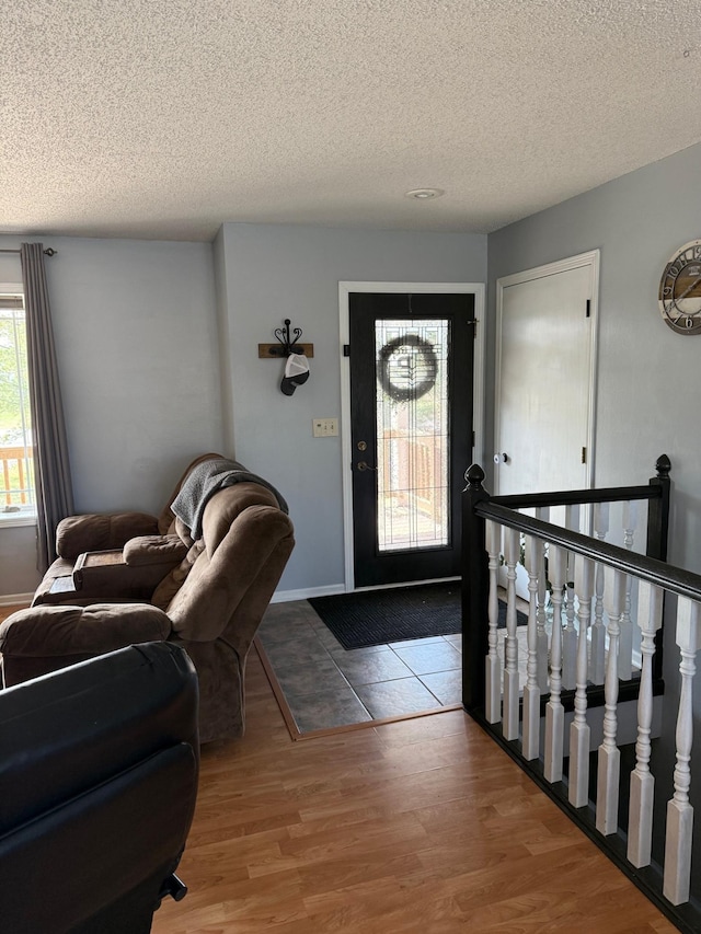 9808 Jenny Ln, Saint Wendel Twp, MN 56374 - foyer featuring wood finished floors and a textured ceiling