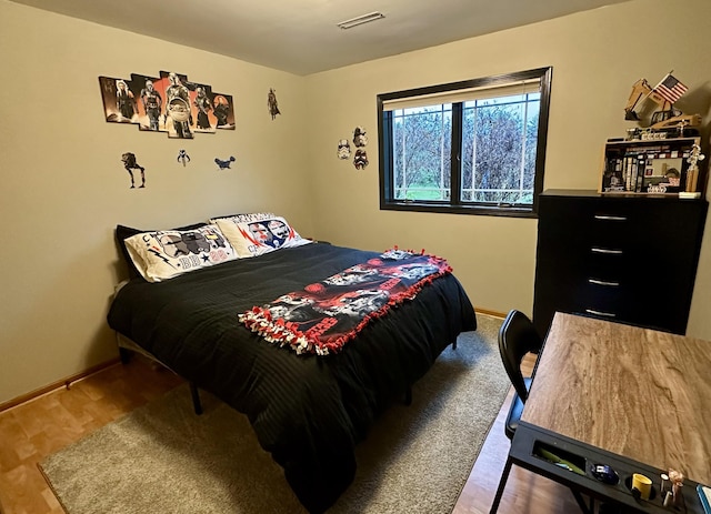 9808 Jenny Ln, Saint Wendel Twp, MN 56374 - bedroom featuring baseboards and wood finished floors