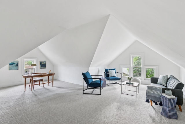 carpeted living room featuring lofted ceiling