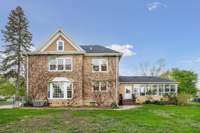rear view of property featuring cooling unit, entry steps, a gate, and a sunroom