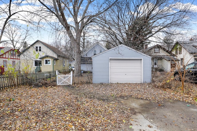 850 22nd Ave SE, Minneapolis, MN 55414 - detached garage with a gate, fence, and a residential view