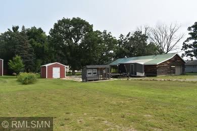 32255 County 21, Browerville, MN 56438 - view of green lawn with an outdoor structure, a shed, and a garage