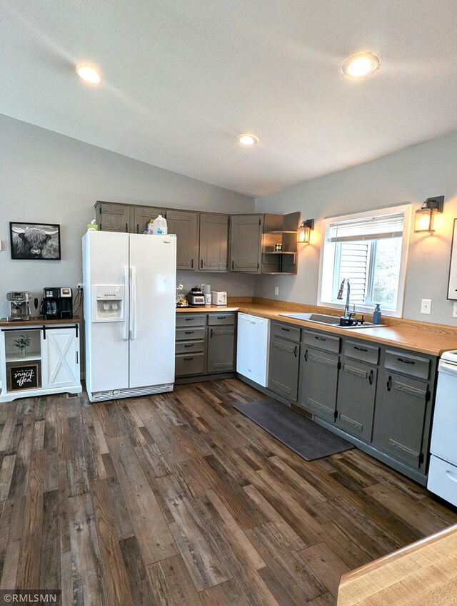 32255 County 21, Browerville, MN 56438 - kitchen featuring white appliances, gray cabinets, a sink, dark wood-style floors, and vaulted ceiling
