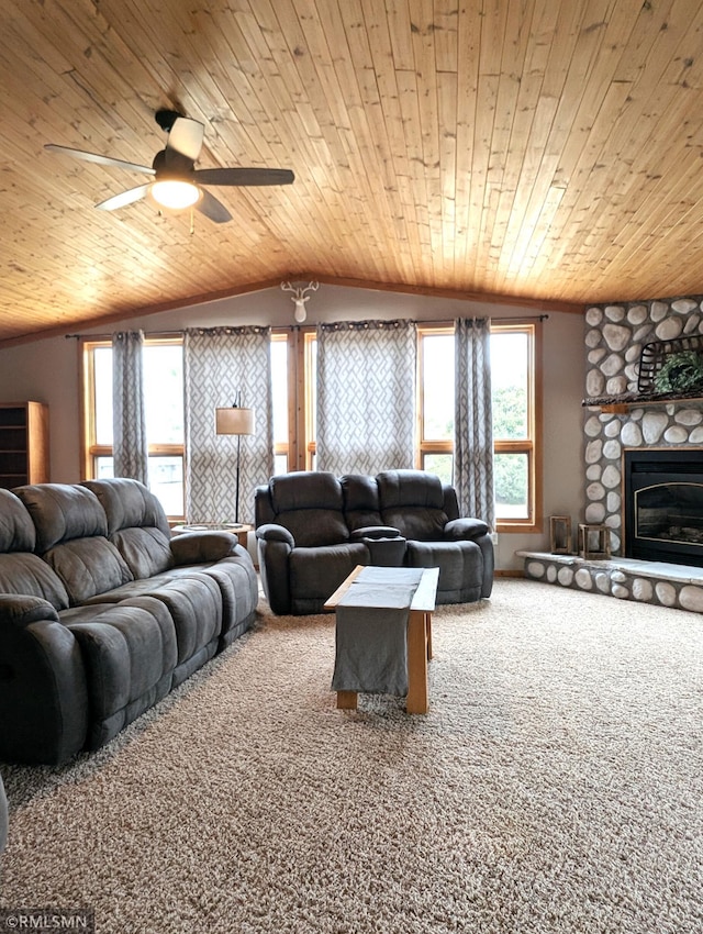 32255 County 21, Browerville, MN 56438 - living area featuring lofted ceiling, wooden ceiling, carpet floors, a stone fireplace, and ceiling fan