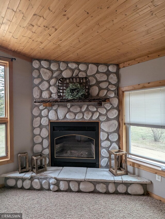 32255 County 21, Browerville, MN 56438 - detailed view of a stone fireplace, carpet flooring, and wood ceiling