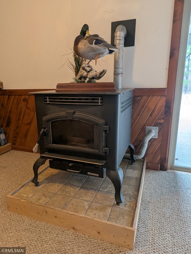 32255 County 21, Browerville, MN 56438 - detailed view of a wood stove, wooden walls, and a wainscoted wall