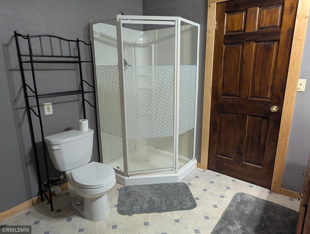 32255 County 21, Browerville, MN 56438 - bathroom featuring baseboards, a stall shower, toilet, and tile patterned floors