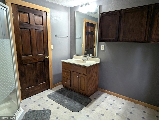32255 County 21, Browerville, MN 56438 - full bathroom featuring a shower stall, baseboards, vanity, and tile patterned floors