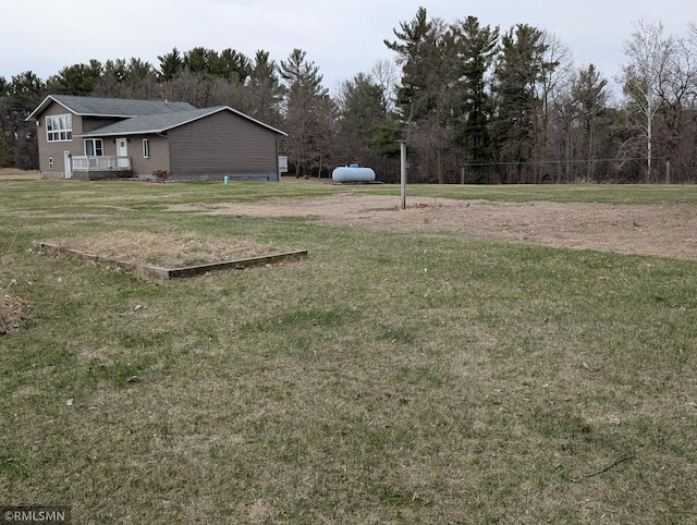 32255 County 21, Browerville, MN 56438 - view of grassy yard featuring a deck and a wooded view
