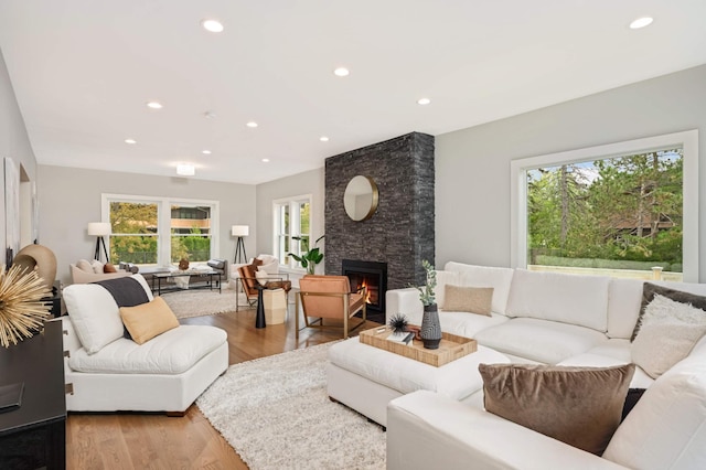1647 26th St, Minneapolis, MN 55405 - living room featuring healthy amount of natural light, light wood finished floors, recessed lighting, and a large fireplace