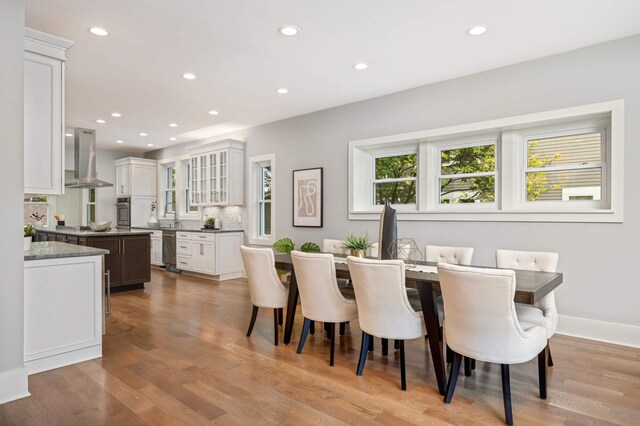 1647 26th St, Minneapolis, MN 55405 - dining space with recessed lighting, light wood-style floors, and baseboards