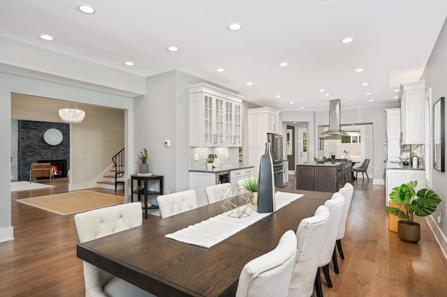 1647 26th St, Minneapolis, MN 55405 - dining room with stairs, recessed lighting, baseboards, and wood finished floors