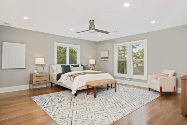 1647 26th St, Minneapolis, MN 55405 - bedroom featuring recessed lighting, wood finished floors, baseboards, and a ceiling fan