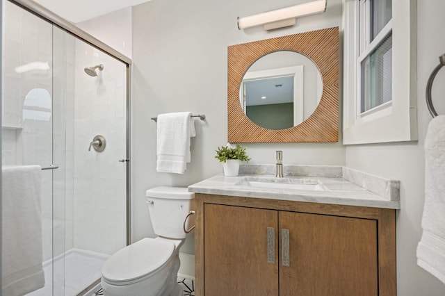 1647 26th St, Minneapolis, MN 55405 - full bathroom with toilet, a shower stall, and vanity