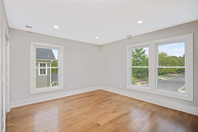1647 26th St, Minneapolis, MN 55405 - unfurnished room featuring light wood-type flooring, baseboards, and recessed lighting
