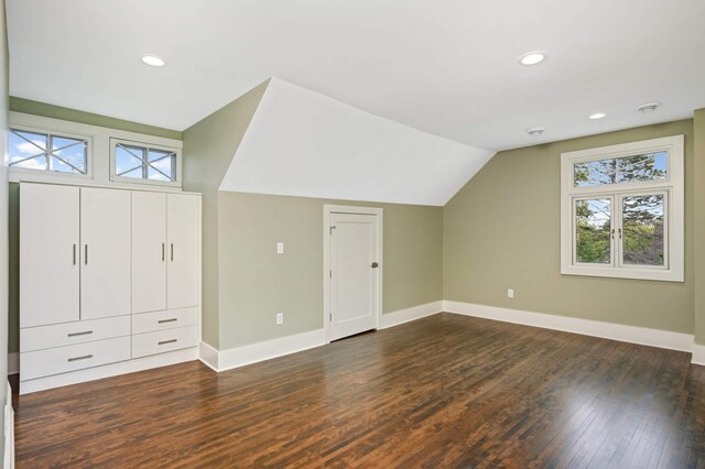 1647 26th St, Minneapolis, MN 55405 - additional living space featuring baseboards, dark wood-type flooring, vaulted ceiling, and recessed lighting