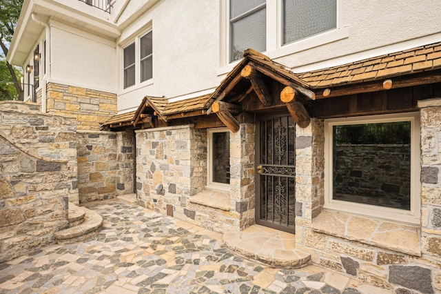 1647 26th St, Minneapolis, MN 55405 - property entrance with stone siding and stucco siding