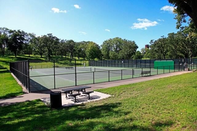 1647 26th St, Minneapolis, MN 55405 - view of tennis court with view of wooded area