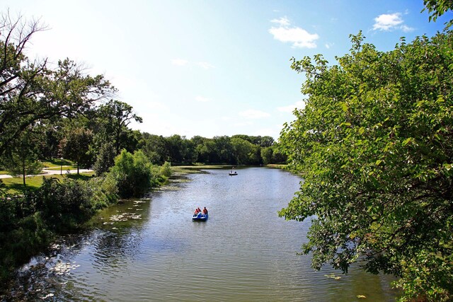 1647 26th St, Minneapolis, MN 55405 - water view featuring a heavily wooded area