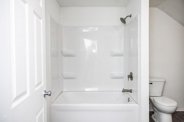 bathroom with a tub to relax in, baseboards, toilet, and a shower