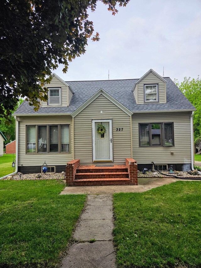 327 2nd St SW, Clara City, MN 56222 - view of front of property featuring a front yard and a shingled roof