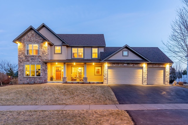 17639 Heidelberg Way, Lakeville, MN 55044 - craftsman inspired home featuring stone siding, driveway, a porch, an attached garage, and roof with shingles