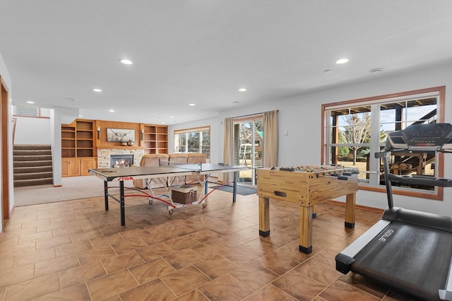 17639 Heidelberg Way, Lakeville, MN 55044 - playroom featuring recessed lighting, a stone fireplace, and built in shelves