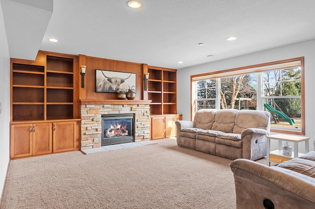 17639 Heidelberg Way, Lakeville, MN 55044 - living room with carpet floors, recessed lighting, a stone fireplace, a textured ceiling, and built in features