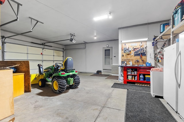 17639 Heidelberg Way, Lakeville, MN 55044 - garage featuring a workshop area, freestanding refrigerator, and a garage door opener