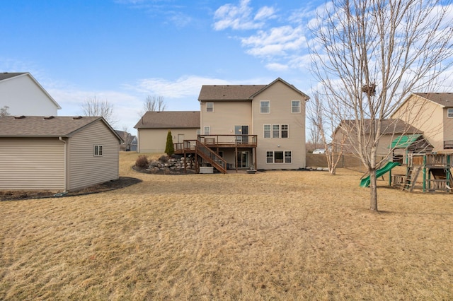 17639 Heidelberg Way, Lakeville, MN 55044 - back of property featuring stairway, a playground, a wooden deck, and a lawn