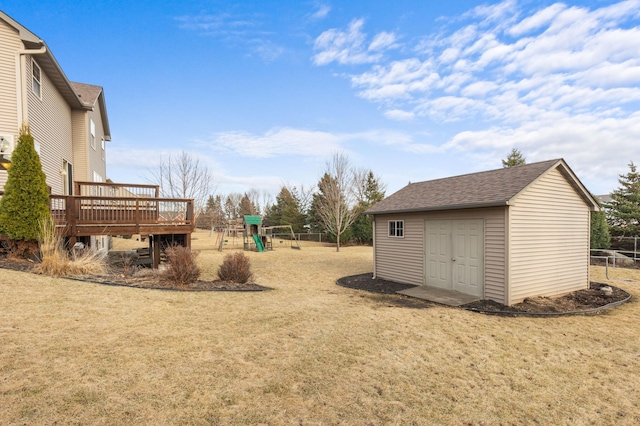 17639 Heidelberg Way, Lakeville, MN 55044 - view of yard featuring a wooden deck, a playground, and an outdoor structure
