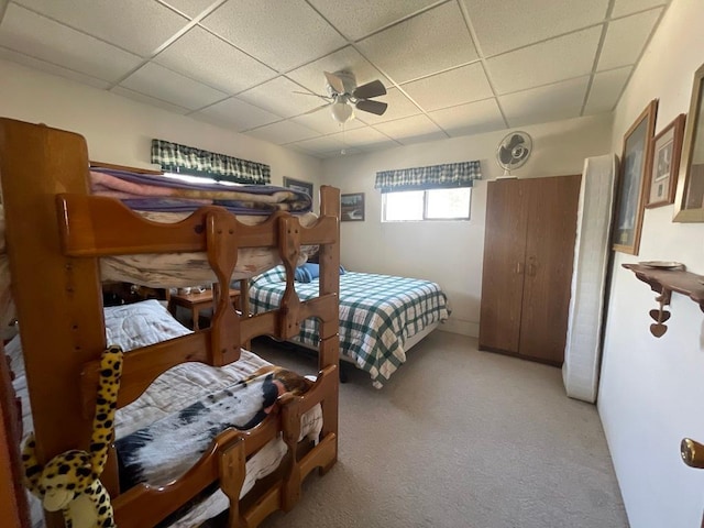 17999 Ivy Dr, Park Rapids, MN 56470 - bedroom featuring a paneled ceiling, light carpet, and ceiling fan