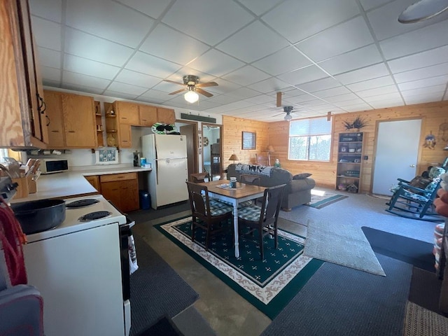 17999 Ivy Dr, Park Rapids, MN 56470 - kitchen featuring white appliances, wooden walls, ceiling fan, a paneled ceiling, and open shelves