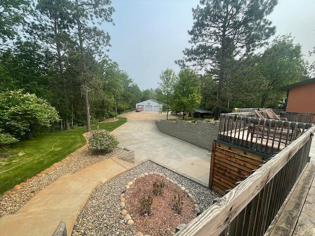 17999 Ivy Dr, Park Rapids, MN 56470 - view of green lawn with a wooden deck