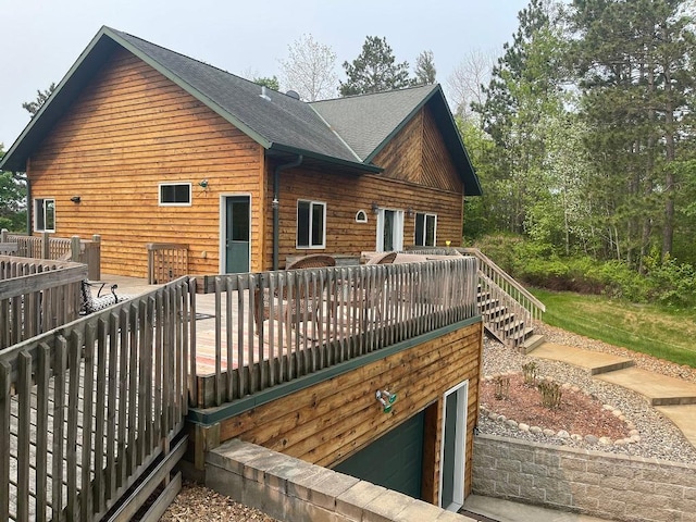 17999 Ivy Dr, Park Rapids, MN 56470 - back of house featuring a wooden deck and a shingled roof