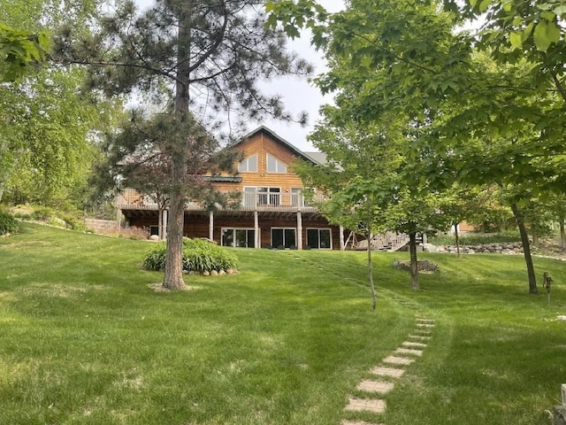 17999 Ivy Dr, Park Rapids, MN 56470 - rear view of property with a yard and a deck