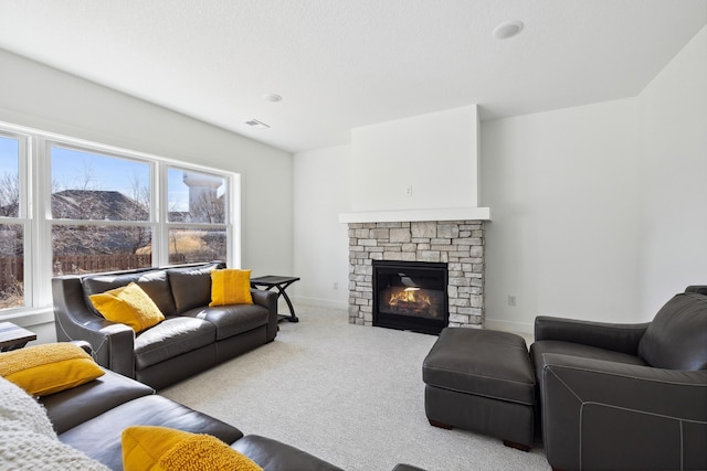 4240 Inland Ln N, Plymouth, MN 55446 - living area featuring a fireplace, carpet floors, a healthy amount of sunlight, and baseboards