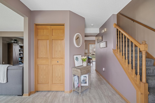104 Birch Ave NW, Saint Michael, MN 55376 - entrance foyer with stairs, baseboards, and a textured ceiling