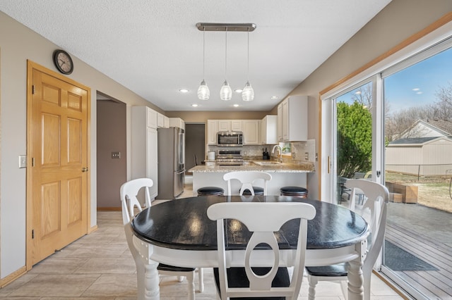 104 Birch Ave NW, Saint Michael, MN 55376 - dining room featuring baseboards and recessed lighting
