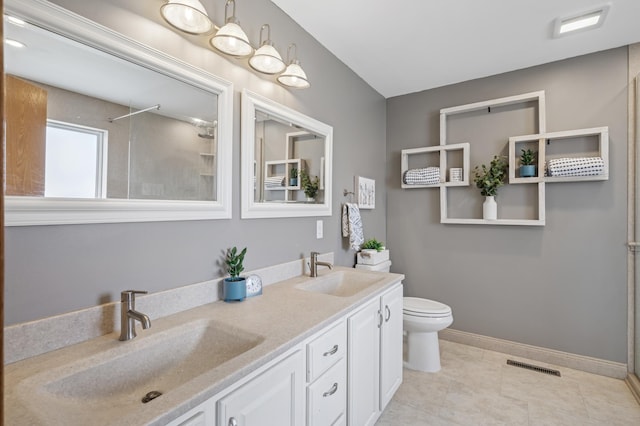104 Birch Ave NW, Saint Michael, MN 55376 - bathroom featuring a shower, double vanity, toilet, and tile patterned floors