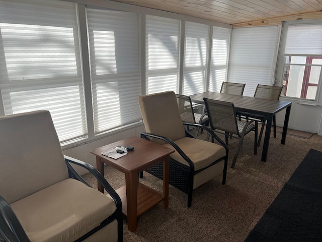 carpeted office space featuring wooden ceiling