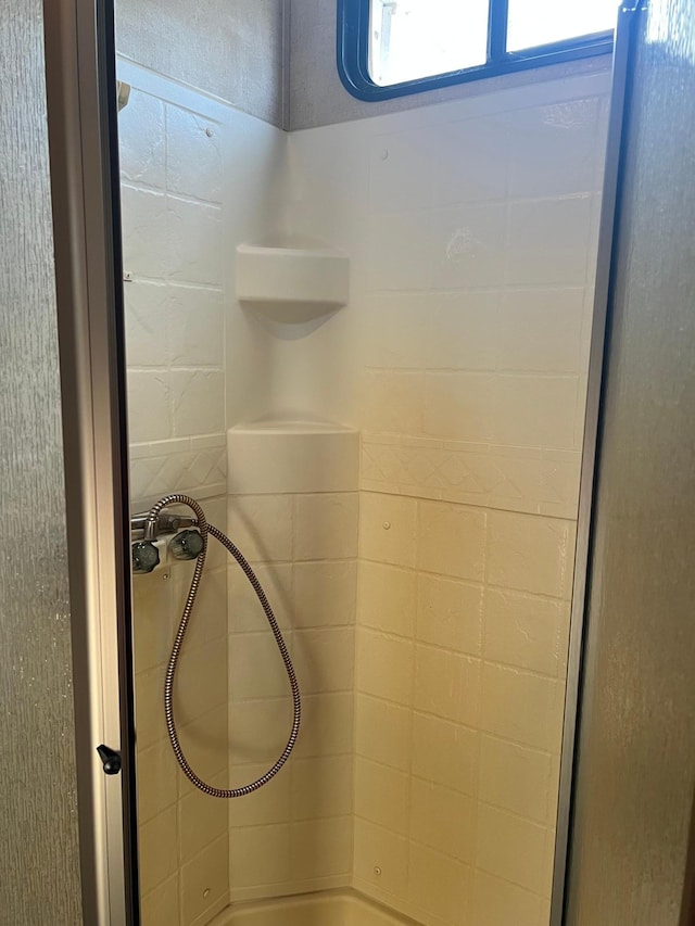 interior details with walk in shower and a tub to relax in
