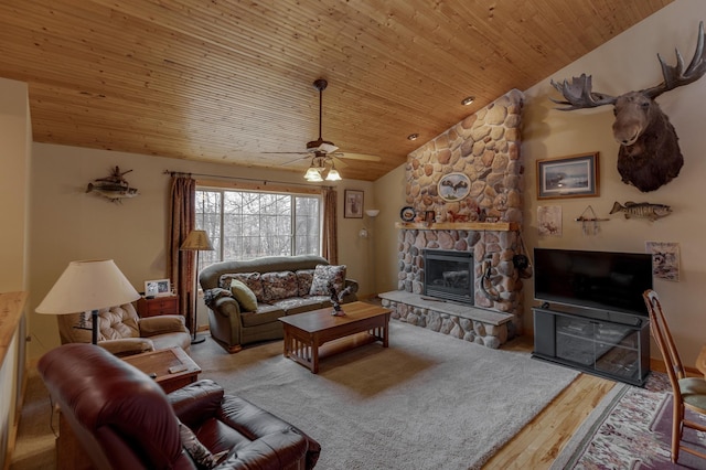 7621 Winter Trl, Breezy Point, MN 56472 - living area featuring a stone fireplace, wood finished floors, lofted ceiling, a ceiling fan, and wooden ceiling