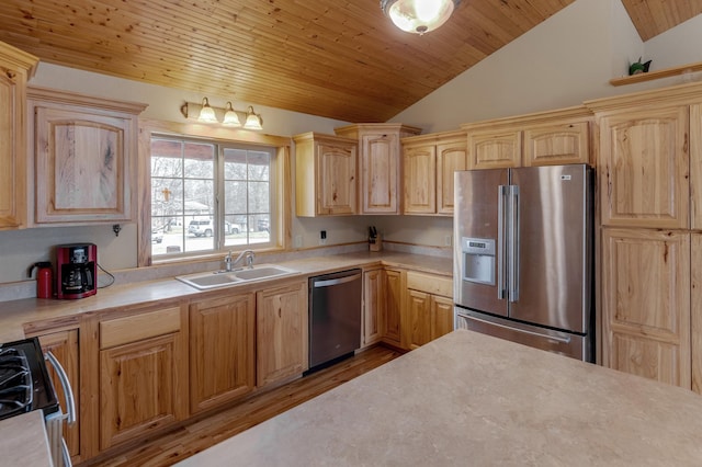 7621 Winter Trl, Breezy Point, MN 56472 - kitchen with stainless steel appliances, a sink, lofted ceiling, light countertops, and wood finished floors