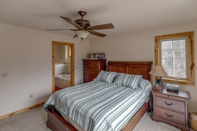 7621 Winter Trl, Breezy Point, MN 56472 - bedroom featuring light carpet, ceiling fan, ensuite bathroom, and baseboards