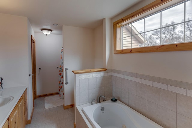 7621 Winter Trl, Breezy Point, MN 56472 - bathroom with tile patterned floors, a tub with jets, vanity, and baseboards